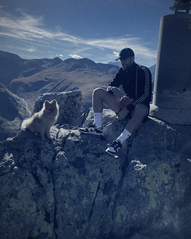 POPI and Flavien on a rock high in the Alps